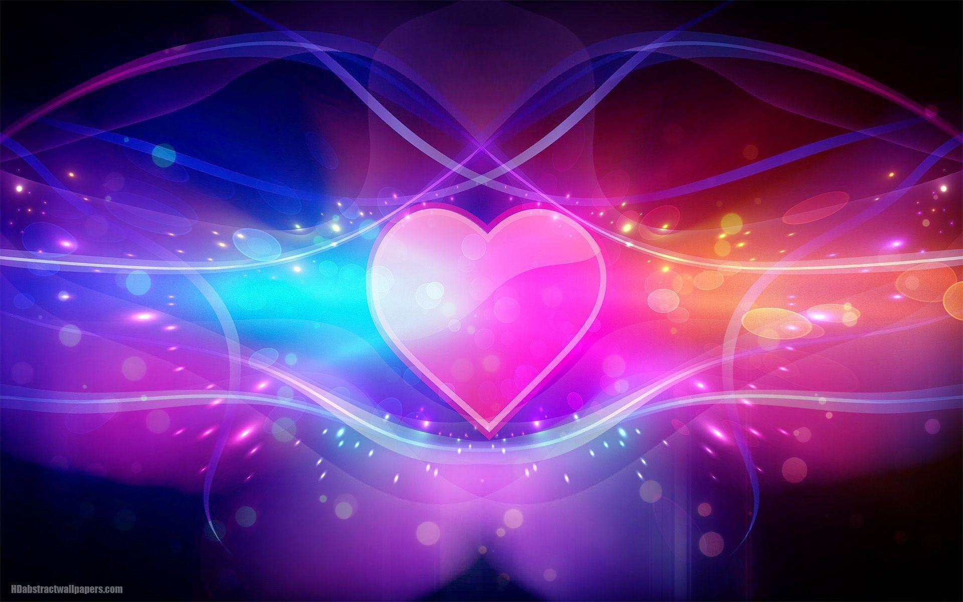 A vibrant image of a pink heart surrounded by glowing lines and colorful bokeh effects.