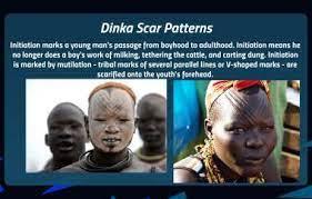 Dinka Scar Patterns
Initiation marks a young man's passage from boyhood to adulthood. Initiation means he
no longer does a boy's work of milking, tethering the cattle, and corting dung. Initiation
is marked by mutilation - tribal marks of several parallel lines or V-shoped marks-are
scarified onto the youth's forehead.