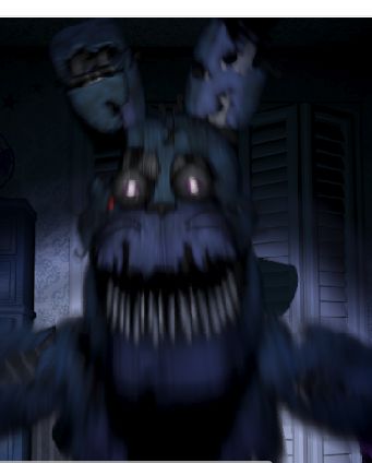 A blurry image of a scary-looking, purple animatronic rabbit with sharp teeth and glowing eyes in a dark room. The rabbit has a damaged face.