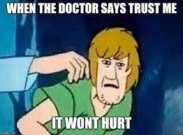 The image shows Shaggy from Scooby-Doo looking worried. Text above him says, "When the doctor says trust me" and below him, "It won't hurt."