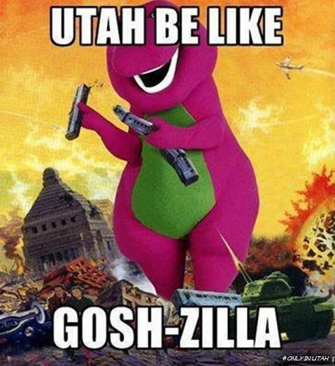 The image shows a large, purple Barney dinosaur character holding two guns. He stands in front of a destroyed city, with explosions and debris all around. The text above Barney reads "Utah be like" and the text below reads "Gosh-zilla". A hashtag at the bottom right says "#onlyinutah".