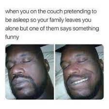 The meme depicts a person pretending to be asleep on a couch to be left alone by their family. The image shows a man with eyes closed in the left panel and the same man smiling with open eyes in the right panel. The text says, "when you on the couch pretending to be asleep so your family leaves you alone but one of them says something funny."