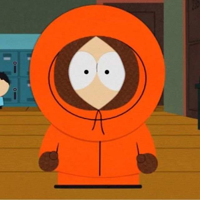 A full body cartoon image of Kenny from South Park wearing his iconic orange parka. He is standing in a hallway and looking forward. The text on the post is: "WE LOVE KENNY (him dies A LOT)"