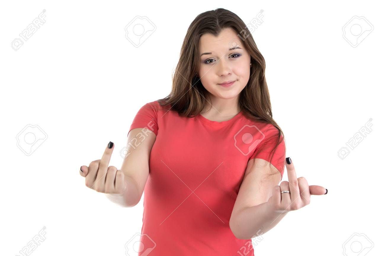 A young woman with long brown hair, wearing a red shirt, gives the middle finger with both hands. The background is white.