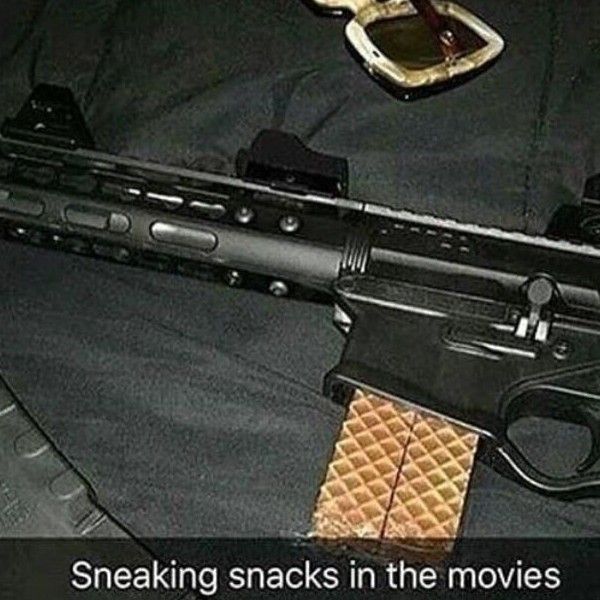 A close-up shot of a black assault rifle with a waffle in place of a magazine. Text on the bottom says, "Sneaking snacks in the movies."