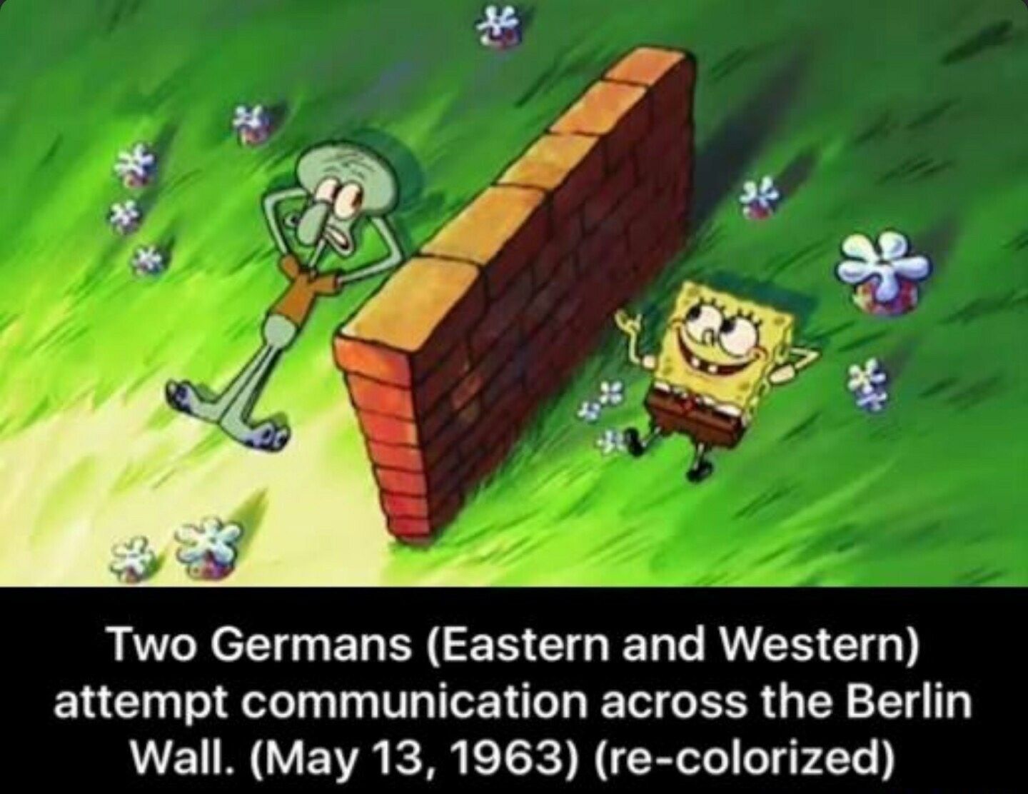 The image shows Squidward on one side of a brick wall and Spongebob on the other side. Below the image it says: "Two Germans (Eastern and Western) attempt communication across the Berlin Wall. (May 13, 1963) (re-colorized)".