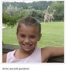 A young girl smiles at the camera, with giraffes visible in the background. The text says "At the zoo with grandma!!"