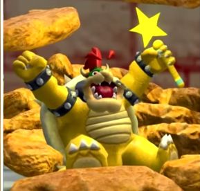 Bowser, a yellow turtle-like character with a red tuft of hair, is shown with his arms raised and holding a yellow star wand. He appears to be yelling while standing amongst rocky, brown formations.