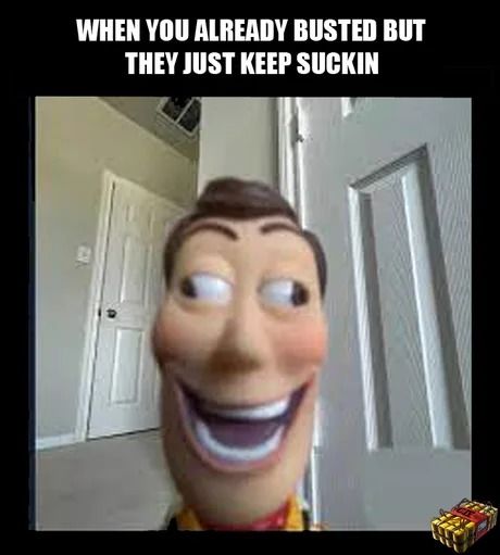 The meme features a close-up shot of a Woody doll with a wide, exaggerated smile and crossed eyes. The text overlay reads, "WHEN YOU ALREADY BUSTED BUT THEY JUST KEEP SUCKIN". In the bottom right corner is a stylized image of a small present.