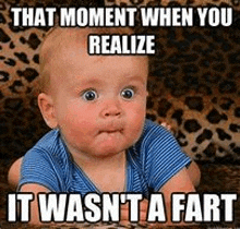 A baby with wide eyes and a surprised face looking directly at the viewer. The text reads: "THAT MOMENT WHEN YOU REALIZE IT WASN'T A FART."