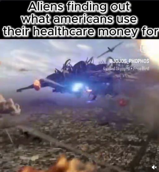 The image shows a spaceship moving above a destroyed landscape. The text on top of the image says, "Aliens finding out what Americans use their healthcare money for." The image also includes the text "@JOJOS_PHOPHOS" and "Lynved Skynyrd - Free Bird".