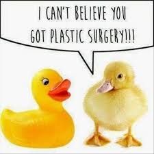 A yellow rubber duck is talking to a yellow fluffy duckling, and it's saying, "I can't believe you got plastic surgery!!!"