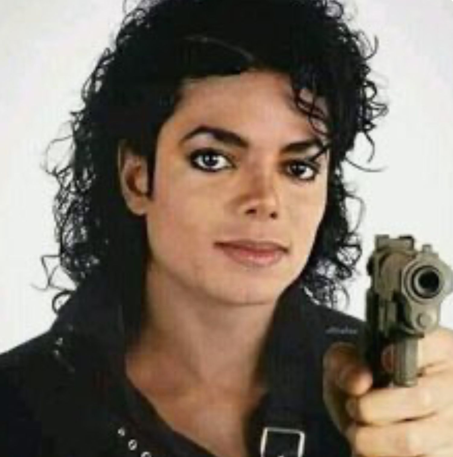 A photo of Michael Jackson holding a gun.