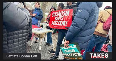 A group of people are holding protest signs. One sign reads "Socialism Beats Fascism!" Another sign says "People over Politics" and "REPAIR MARCH 2025."