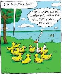 A cartoon drawing of a group of yellow ducklings in a circle on green grass with a white duck in the middle. A speech bubble from the white duck says "Duck, duck, duck, duck..." A thought bubble from one of the yellow ducks says "He's gonna pick me. I know he's gonna pick me... They always pick me..."