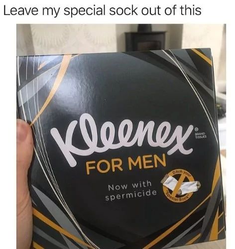 A hand holds a black box of Kleenex tissues with gold and white accents. It reads: "Kleenex FOR MEN. Now with spermicide." An illustration shows a pair of socks with the tagline "Ditch your special sock."