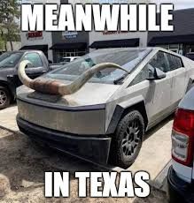 A Cybertruck parked in a parking lot with a large bull horn attached to the front of the car, with the text "MEANWHILE" above the car and the text "IN TEXAS" below the car.