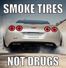 The image shows a white car with its rear end facing the viewer and smoke coming from the tires. The text overlay reads "SMOKE TIRES" at the top and "NOT DRUGS" at the bottom.